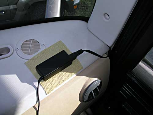 Laptop power brick plugged into extension cord