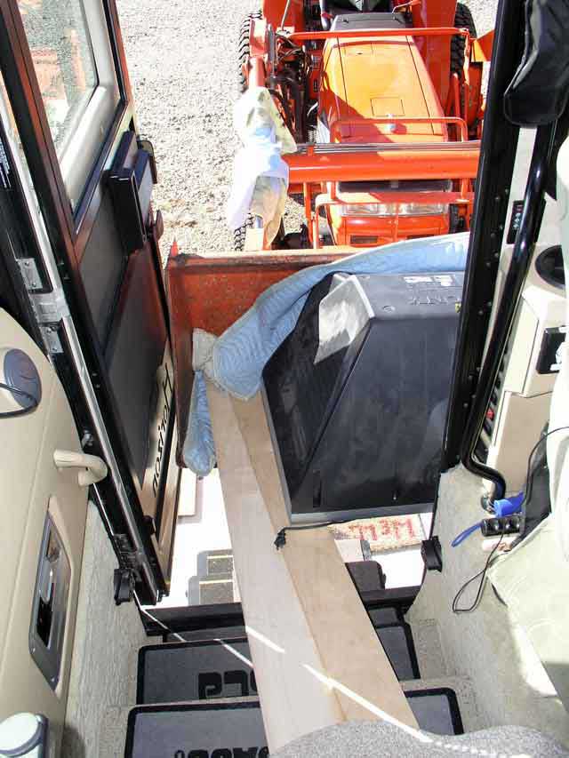 Out of the coach and into the loader bucket